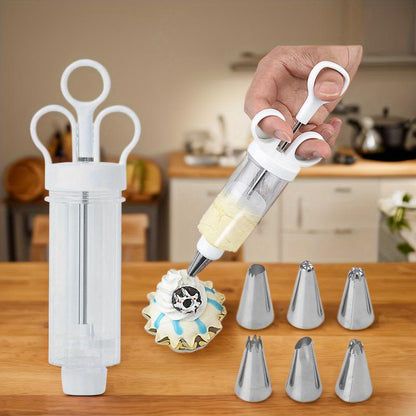🎉 2026 Sale — Over 21,000 Sold! 🧁✨ Stop wrestling with messy piping bags — this stainless steel decorating gun fills, frosts, and finishes in seconds. 18 tips, one tool, endless creativity. 🍰